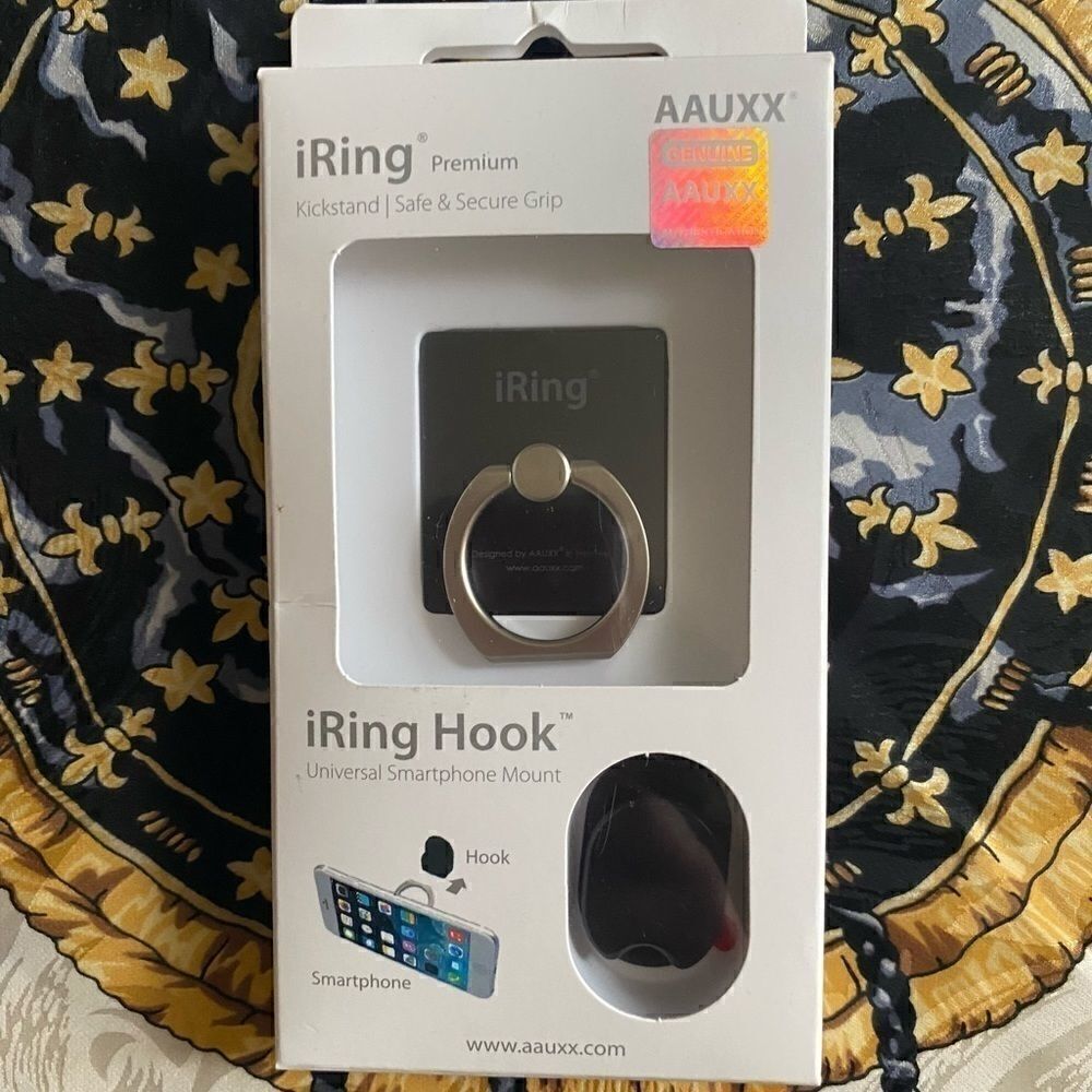 iRing. Universal cell phone grip/mount/stand. Also comes with a hook. NWB